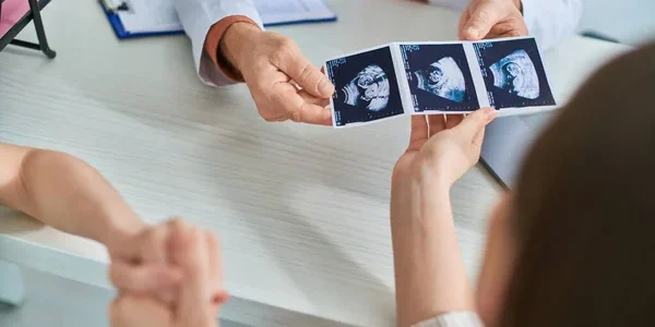 depositphotos_674615644-stock-photo-lesbian-couple-taking-ultrasound-baby